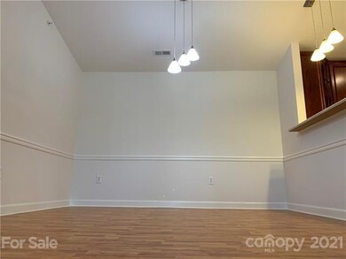 Dining room with upgraded lighting.