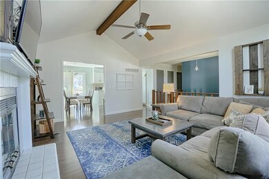 Opens to Dining Room and Kitchen