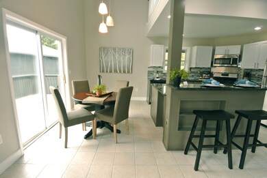 Kitchen & dining area w/ slider to deck