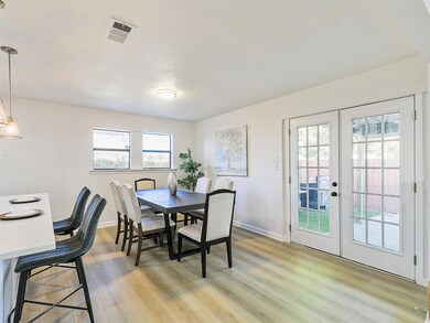 Dining area featuring french doors and light wood-
