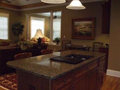 Kitchen/ Hearth Room looks in to the Sunny Bright 
