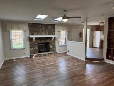 Unfurnished living room featuring a wealth of natu