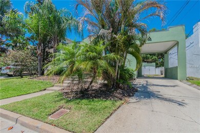 Driveway on side of home leads to carport and deta