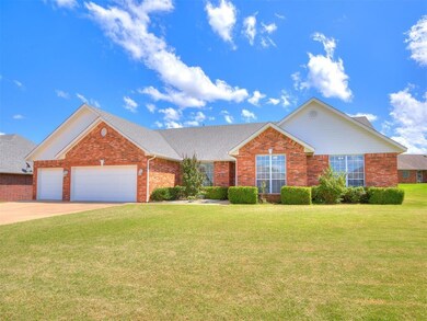 Traditional-style house with brick siding, a front lawn, a garage, concrete driveway, and roof with shingles