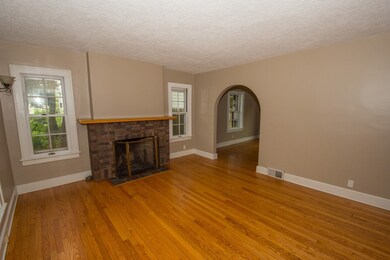 Living Room with wood burning fireplace.