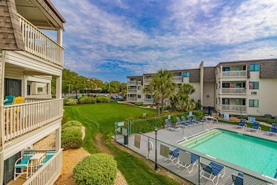 Community pool with a yard and a patio