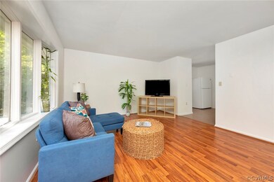 Living room with wood-type flooring