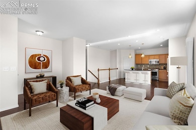 Virtually Staged. Living room featuring wood finished floors