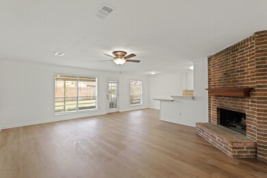 This beautifully designed open-layout living area offers a seamless flow between the living room, dining area, and kitchen, perfect for both entertaining and everyday living.