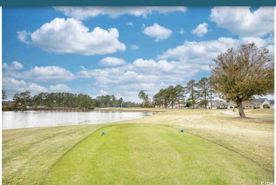 View of home's community featuring a yard, view of