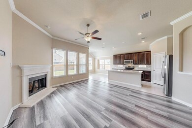 Unfurnished living room featuring crown molding, a