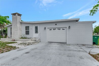 View of front facade with a garage, driveway, entr