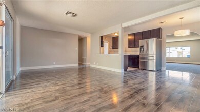 Main living space with new paint, baseboards, floo