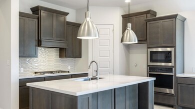 Kitchen featuring stainless steel appliances, a s