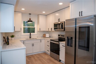 Kitchen featuring stainless steel appliances, sink