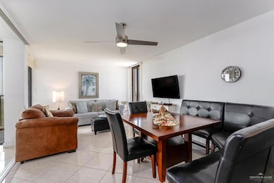 Dining room featuring light tile patterned floors, visible vents, and a ceiling fan