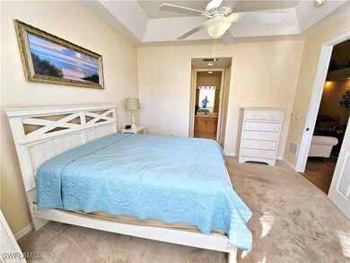 Bedroom featuring visible vents, ensuite bathroom,