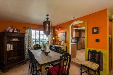 Sunken formal dining room with arched doorway and 
