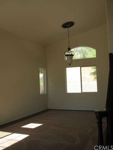 living room with vaulted ceilings, new carpet and 