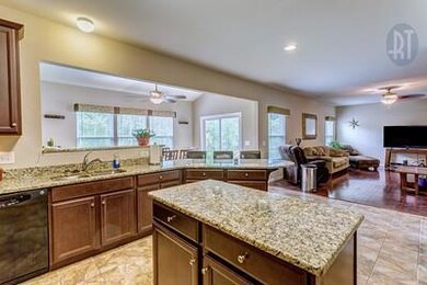 The chef's view.  The chef of the house won't miss any of the action with this open floor plan.