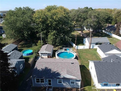View of Home, pool, garage and deep lot