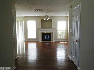 Living Room. Large living area with fireplace and wood floors