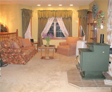 LIVING ROOM WITH WOOD BURNING STOVE