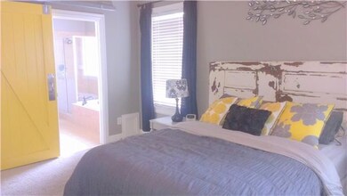 The master suite has all the expected luxury touches. A large soaking whirlpool jetted tub, separate standing shower, double vanities, and a huge customized walk-in closet with built-ins, glass block window for privacy, upgraded faucets and hardware.