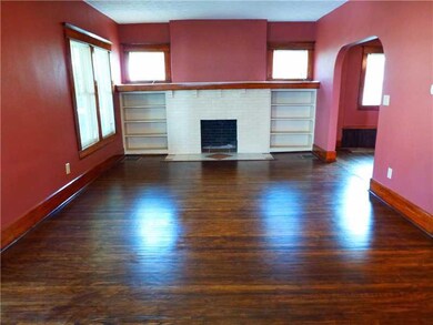 Living Room. Newly refinished hardwood floors and door & window trim.