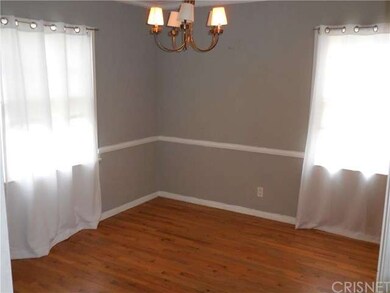 Formal dining room gleaming hardwood floor