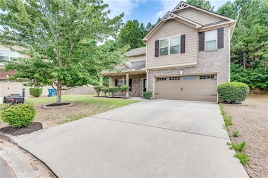 Brick Front House Featuring Front Covered Porch, Garage, Level Drive Way