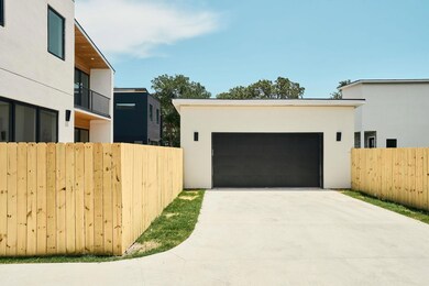 Garage featuring driveway
