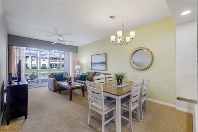 Dining space featuring ceiling fan with notable ch
