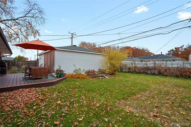 View of yard with a deck and an outbuilding
