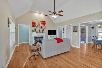 Hardwood floors and a gas fireplace make this a great gathering place.