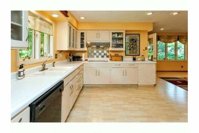 Kitchen. Spacious, open feel.  Light blonde lamina
