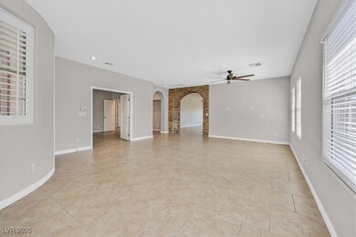 Unfurnished living room with ceiling fan, a wealth