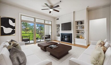 Living room with built in shelves, light hardwood 