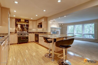 Gourmet kitchen overlooks living areas