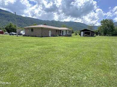 LEFT REAR CORNER VIEW WITH LOT