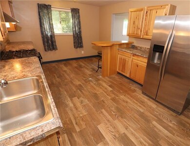NOTICE the open Eat-In area by the window. Perfect