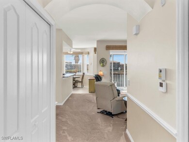 Corridor with carpet floors and baseboards