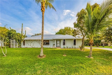Beautiful tropical style curb appeal.