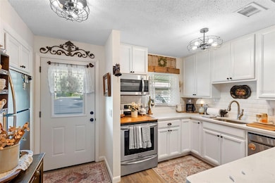 Front door and kitchen