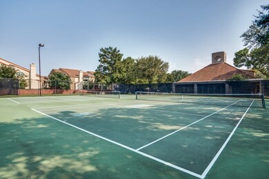 View of tennis court featuring community basketball court