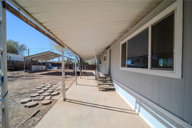 View of patio / terrace with a carport
