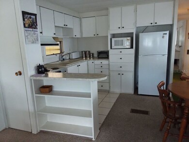 ANOTHER VIEW OF THE KITCHEN FROM LIVING ROOM