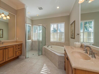 Master bath with crown molding, wood framed mirror