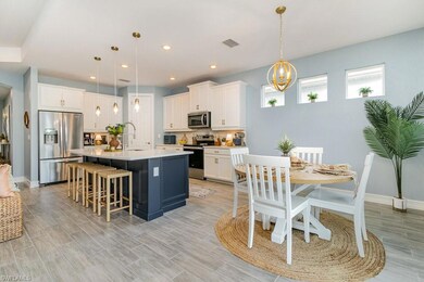 Kitchen featuring pendant lighting, an island with