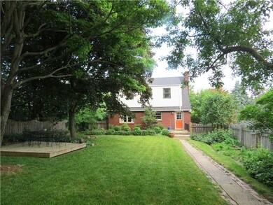 Exterior Back. The rustic fenced in yard is nicely